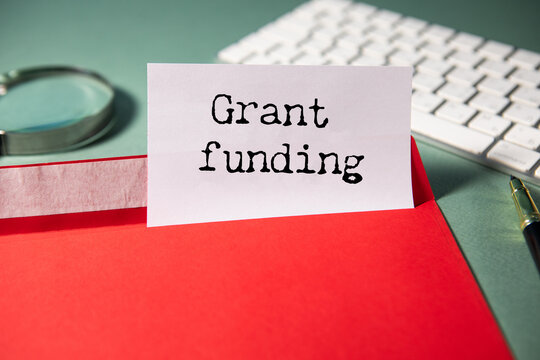Grant funding symbol. text on a page