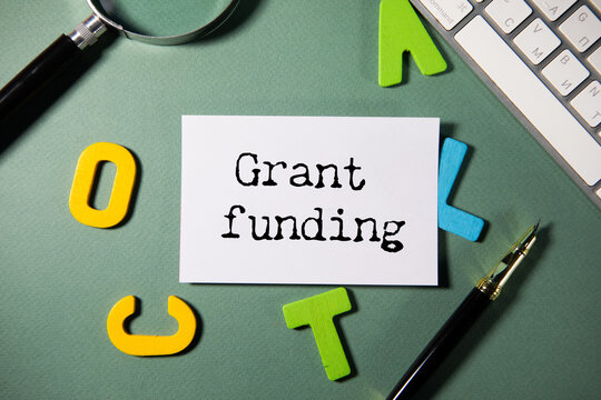 Grant funding symbol. text on a page