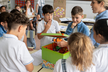 Obraz premium Elementary School Teacher Leading Interactive Classroom Activity with Students
