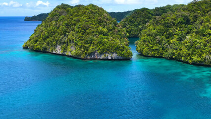 Aerial View of Lush Limestone Rock Islands in Palau Turquoise Lagoon © blueringmedia
