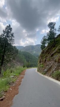 First Person POV Riding on a Scenic Mountain Road Through Pine Forest in Abbottabad, Khyber Pakhtunkhwa, Pakistan | Vertical Video