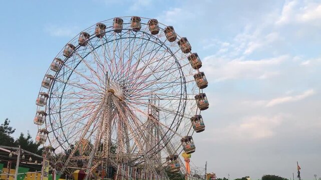 Video of Ferris Wheel or Joint wheel ride playing in night at fair ground during the annual fair.
