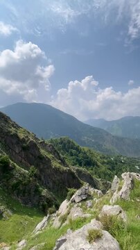 Beautiful landscape footage captured at Malsa, Abbottabad, Pakistan. This video features breathtaking mountain views, lush green hills, dramatic white clouds, blue sky, and peaceful natural scenery 