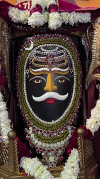 4k clip of Shivling or shiv lingam decorated with colours and flowers to worship lord shiv. Selective focus.