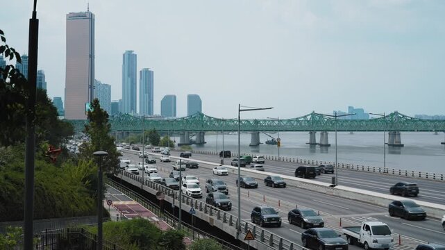 Yeouido skyline and heavy traffic on Seoul Han river road.
