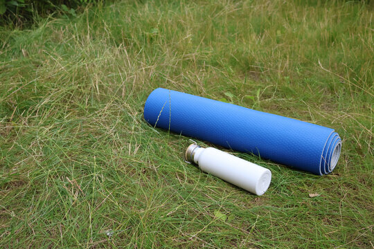 Yoga mat on the grass, sports, hobbies and recreation, outdoor fitness