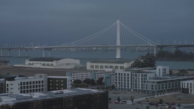 San Francisco Bay Bridge at Dusk With Overcast Sky - Aerial View
