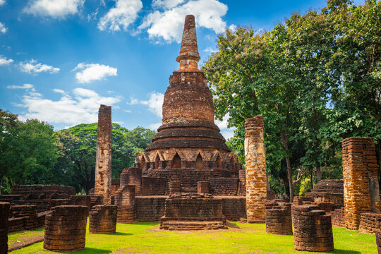 Admire the grand bell-shaped principal chedi and surrounding laterite pillars of Wat Phra Kaeo inside the UNESCO-listed Kamphaeng Phet Historical Park, Thailand.