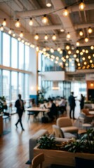 Fototapeta premium A stylish open-concept office with warm overhead lighting and busy employees.