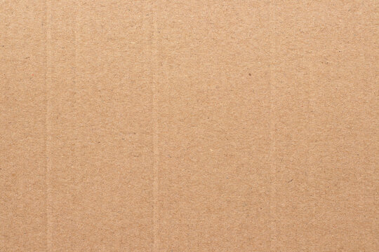 Brown cardboard sheet abstract background, texture of recycle paper box in old vintage pattern for design art work.