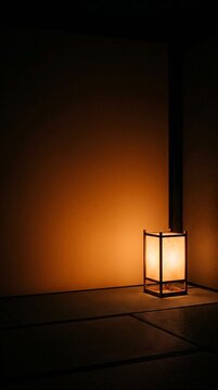 Vertical Serene Night Washitsu with Warm Light from Paper Ando Lantern and Dark Copy Space