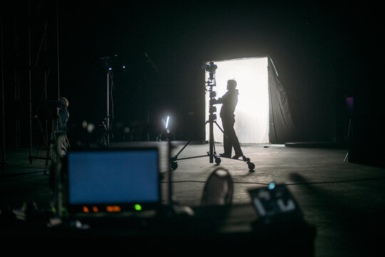 Film set, monitors and modern shooting equipment. Film crew, lighting devices, monitors, playbacks - filming equipment and a team of specialists in filming movies, advertising and TV series