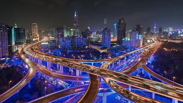 Zoom in pan down time lapse of busy elevated road intersection with commuters with neon lighting, at night, Asia, China, Shanghai
