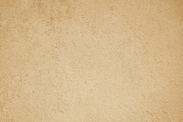 Rough light brown plaster wall texture ideal for backgrounds in design projects like interior decor or architectural visualization. Texture is grainy, bumpy, and solid. © Dinamartina93