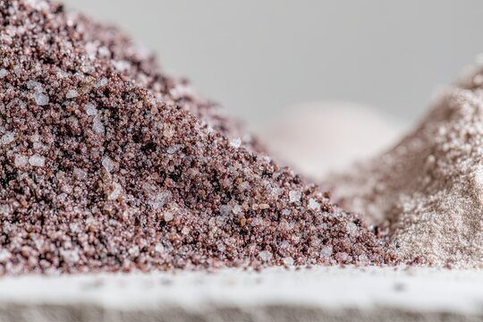 Close-up texture of a large pile of mixed gravel and sand aggregate, ready for construction projects