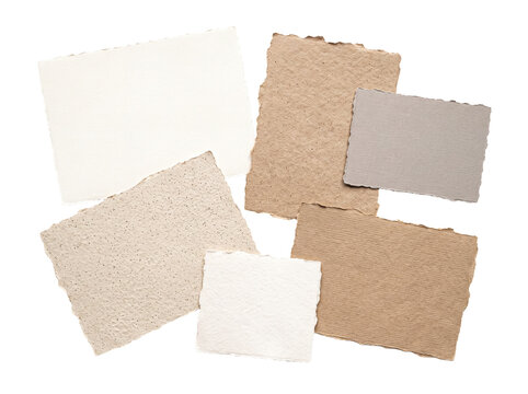 Assortment of rustic handmade paper fragments in various natural tones, with rough edges.