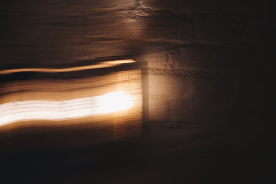 Copper & Cadence &mdash; Cinematic abstract of a cozy late-night recording studio workspace, featuring warm ambient light dragging across raw jute textures, instrument geometry, and fluid intentional camera