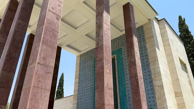 Saadi Shiraz palace architecture with pillar column in Islamic Persian spiritual poetry of Iran poet culture serene tile stone view of mausoleum tomb dome with turquoise color in outdoor garden design