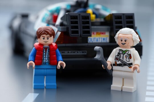 Tambov, Russian Federation - June 20, 2026 Lego minifigures of Marty McFly and Doc Brown standing in front of the DeLorean time machine car from Back to the Future.