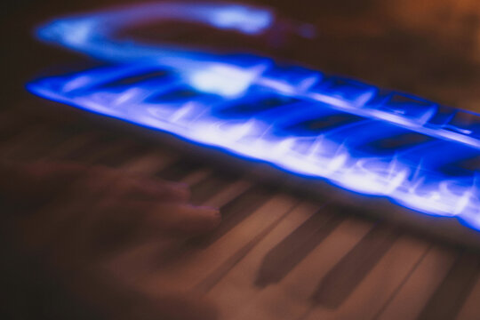 Copper & Cadence &mdash; Cinematic abstract of a cozy late-night recording studio workspace, featuring warm ambient light dragging across raw jute textures, instrument geometry, and fluid intentional camera