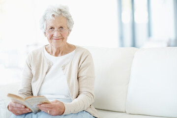 Obraz premium Relax, portrait or old woman in house with book, fantasy reading or insight in literature hobby. Space, glasses or senior person on sofa with fairytale, peaceful moment or fiction story in retirement