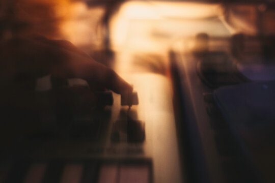Copper & Cadence &mdash; Cinematic abstract of a cozy late-night recording studio workspace, featuring warm ambient light dragging across raw jute textures, instrument geometry, and fluid intentional camera
