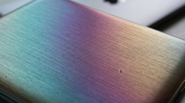 Anodized aluminum rainbow iridescent brushed texture