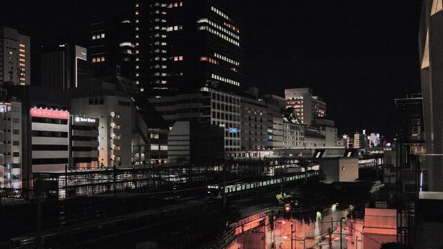 Night in Tokyo  :  Passing Night Trains at Ikebukuro Station amid the Movement and Stillness Under City Lights  |  Ikebukuro, Tokyo, Japan