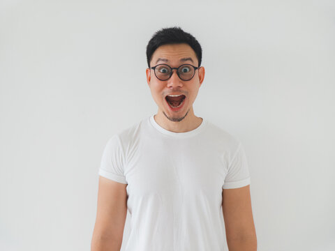 Individual dressed entirely in white exhibits obvious astonishment visibly