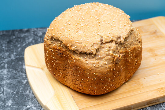 Homemade millet wheat bread on breadboard