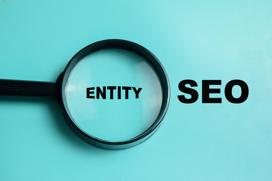 Concept of entity SEO write on book isolated on Wooden Table. For semantic search and search engine understanding