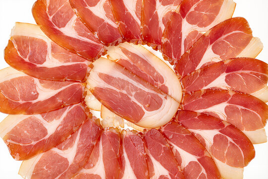 Cured jamon slices arranged in circle pattern