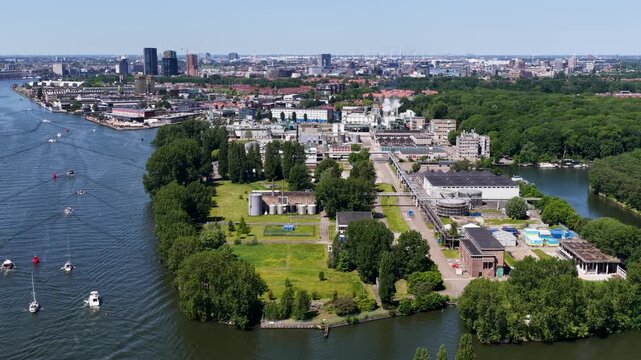 Aerial view of the Ketjen industrial area in Amsterdam-West, the Netherlands, along the IJ river, next to which a new residential area is being built.