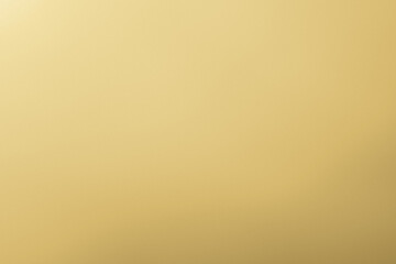 Fototapeta premium Elegant gold gradient background with smooth golden tones and copy space (palegold gold)
