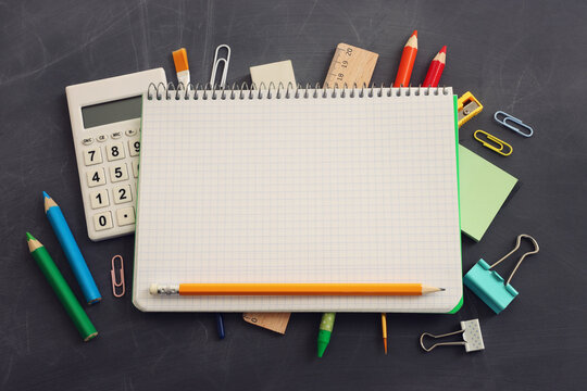 Back to school concept over classroom blackboard. Top view