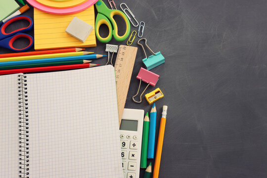 Back to school concept over classroom blackboard. Top view