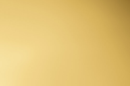 Elegant gold gradient background with smooth golden tones and copy space (creamgold gold)