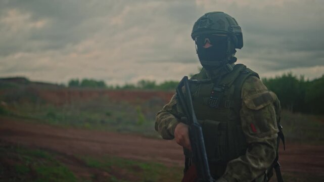 soldier aiming and shooting with a rifle in an outdoor, open field under cloudy sky, focused and alert in a third-person perspective from behind the subject, military training sequences.