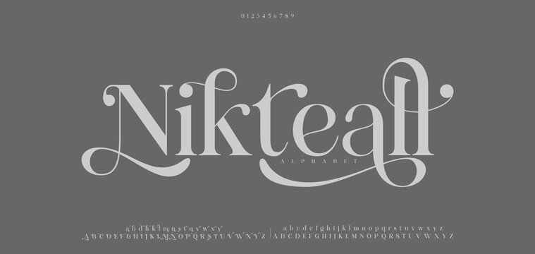 Nikteall typography beauty fashion elegant minimalist serif italic fonts decorative wedding vintage retro logos. Minimal luxury font alphabet logo. Vector illustration