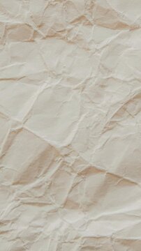 Vertical Animation of Crumpled Beige Paper Texture Background