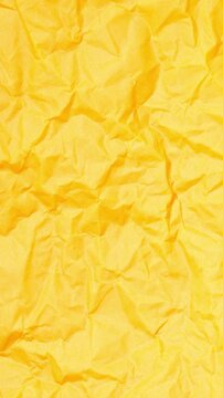 Vertical Abstract Animation of Crumpled Bright Yellow Paper Texture Background