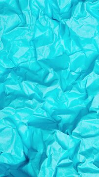 Vertical Abstract Animation of Crumpled Vivid Blue Paper Texture Background