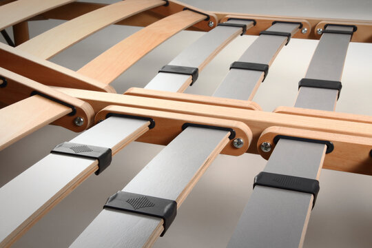 Close up of a bed base, with wooden slats