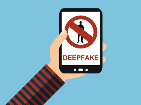 Person h&auml;lt Handy: Deepfakes verboten