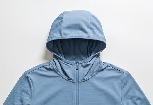 Detailed front view of a light blue hoodie with a zipper, fabric texture visible, isolated on white.