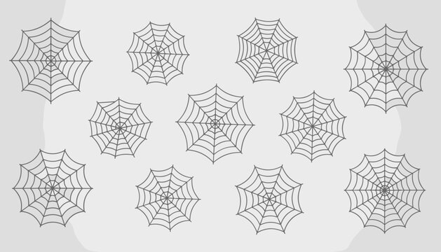 Collection of various spooky spider webs of different shapes and patterns isolated on a light grey textured background.