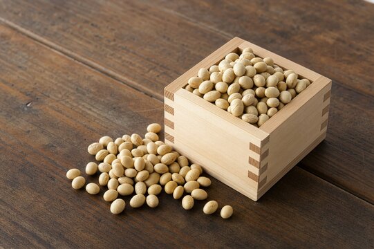apanese Setsubun roasted soybeans in a plain wooden masu box