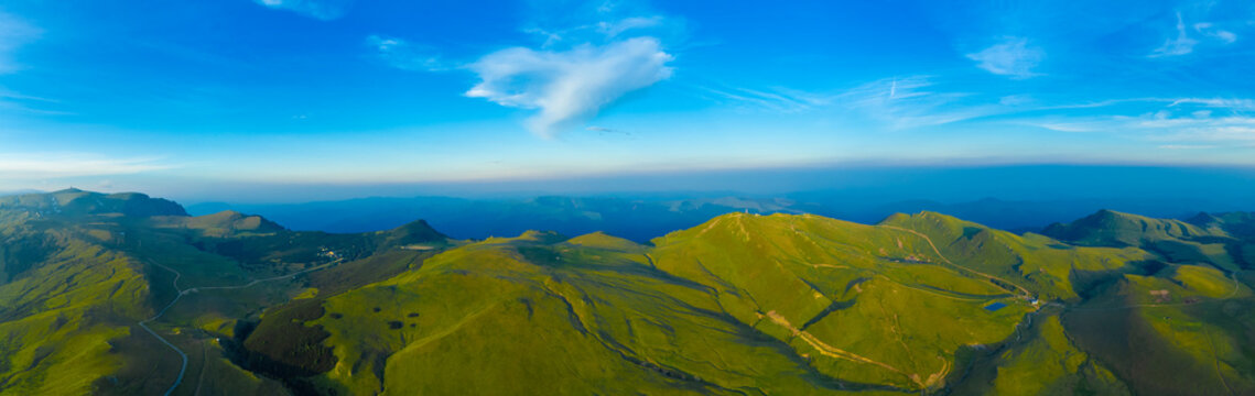 Panoramic view of the rolling green Bucegi mountains - Romania