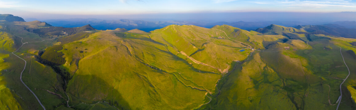 Panoramic view of the rolling green Bucegi mountains - Romania