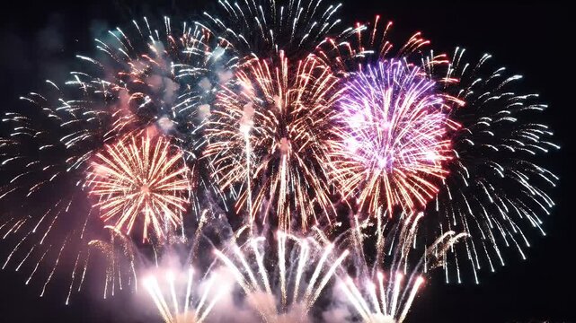 Colorful Nighttime Fireworks Illuminate Sky in Celebration.